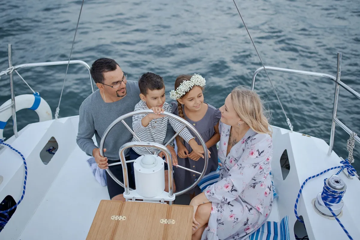 Family sharing a fishing trip on the water